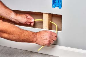 Mastering Electrical Wiring: A Comprehensive Guide to Running Wires through Finished Walls